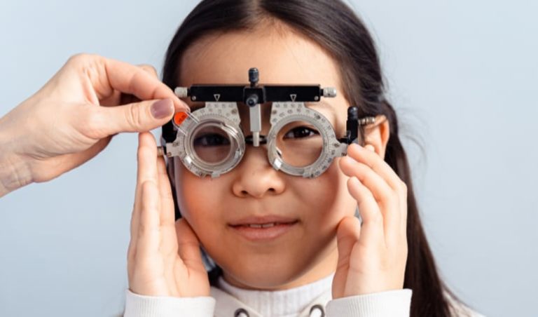 Young girl getting eye exam